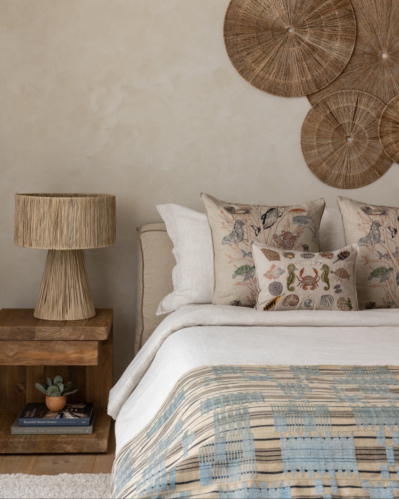 Coral & Tusk embroidered coastal pillow with a vintage textile in Stephanie's personal collection