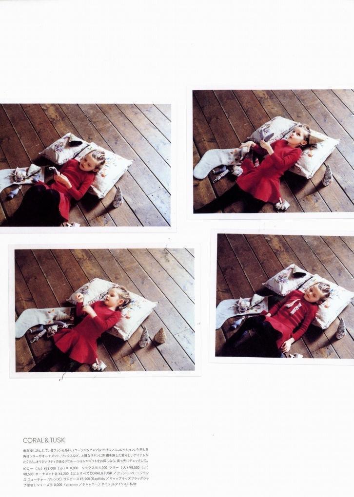 Girl in red Christmas dress sitting on a Coral & Tusk pillow, featured in Milk Japon magazine.