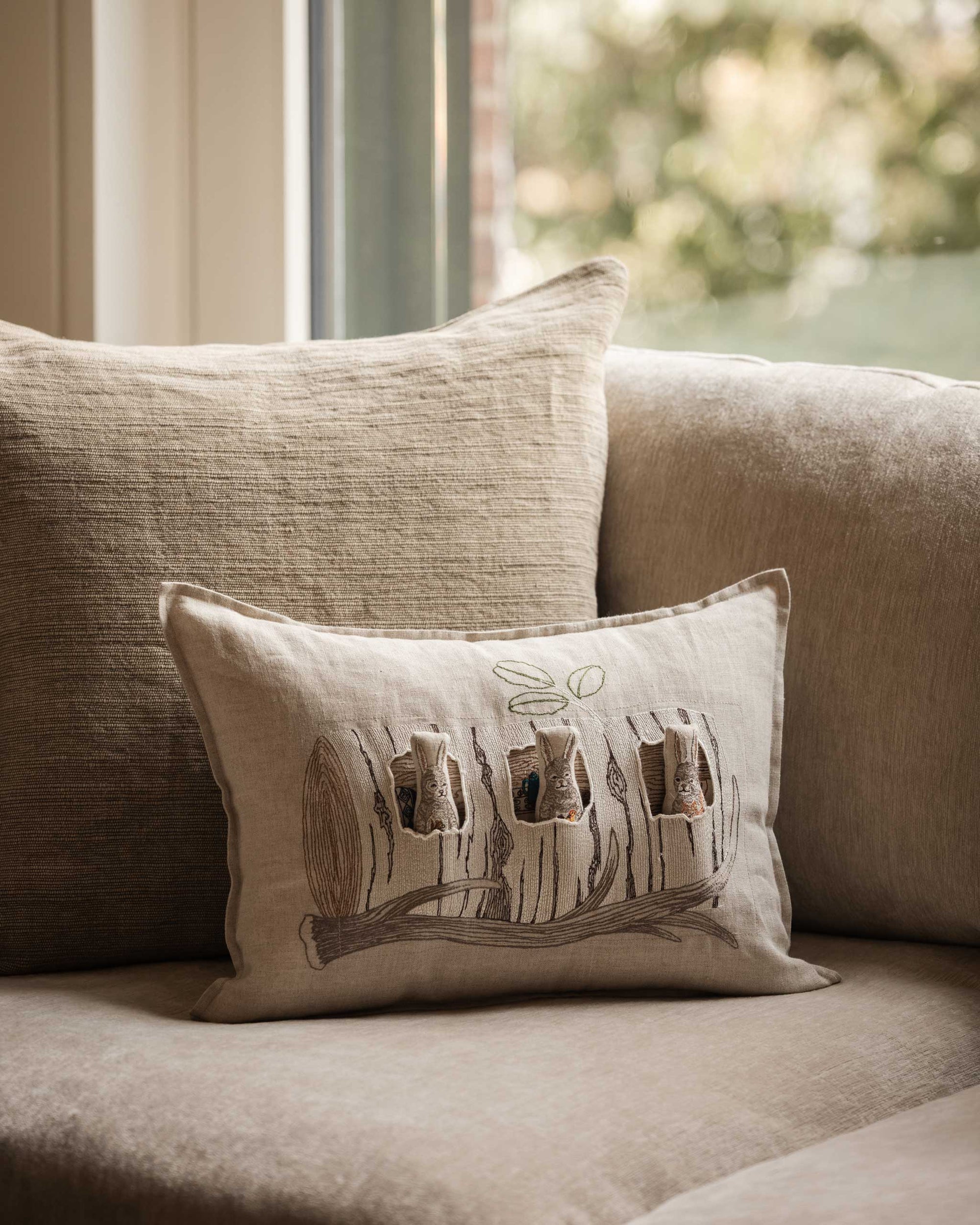 Aspen Log Bunnies Pocket Pillow