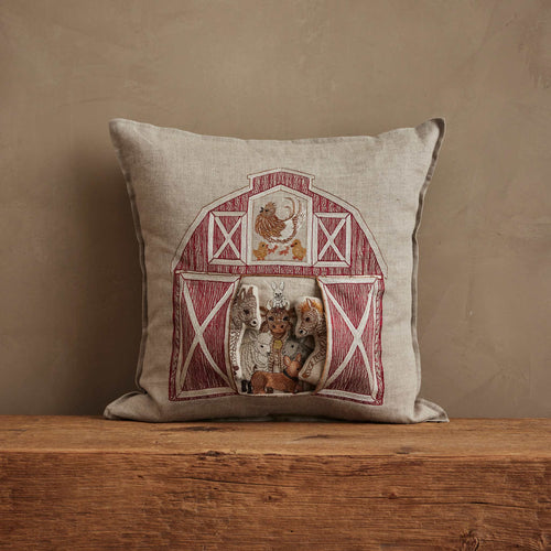Coral & Tusk 16 × 16-inch embroidered linen Red Barn Pocket Pillow featuring farm animals including cows, lambs, roosters, and pigs, with two removable ponies that can be played with outside the pocket.