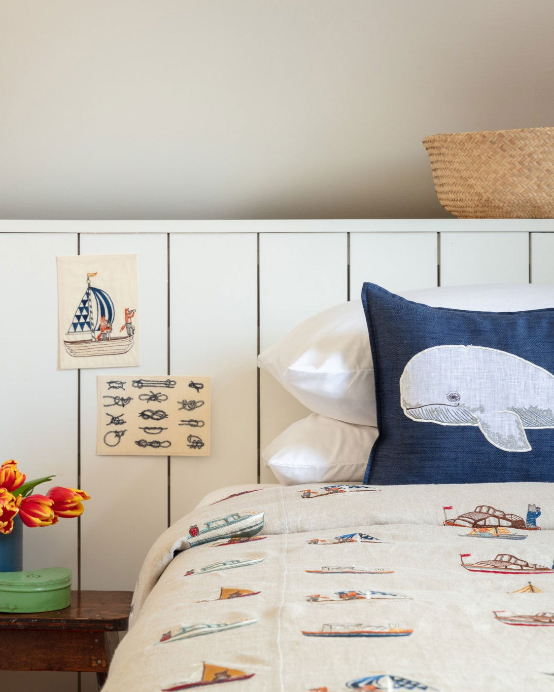 Coral & Tusk Sailboat Card on the wall of a coastal bedroom